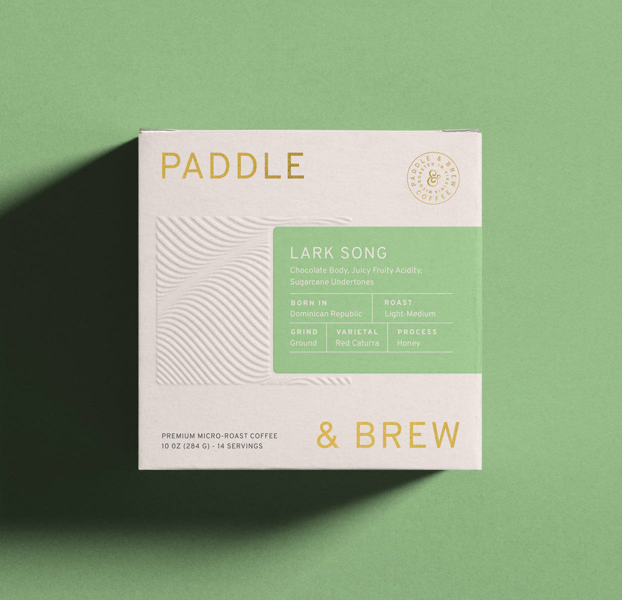 Bag of Lark Song light-medium roast coffee beans from Dominican Republic. Honey Processed, Chocolate and Sugarcane notes.